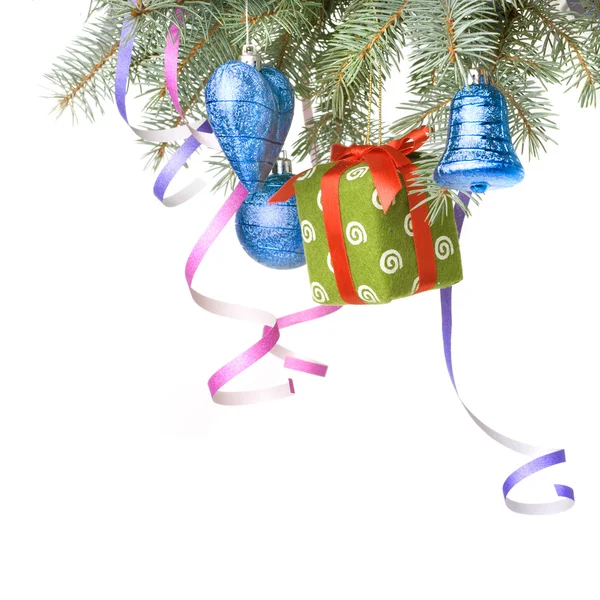:Christmas balls, gift and decoration on fir tree branch — Stock Photo, Image