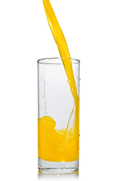 Помаранчевий сік, що запікається в склянку — стокове фото