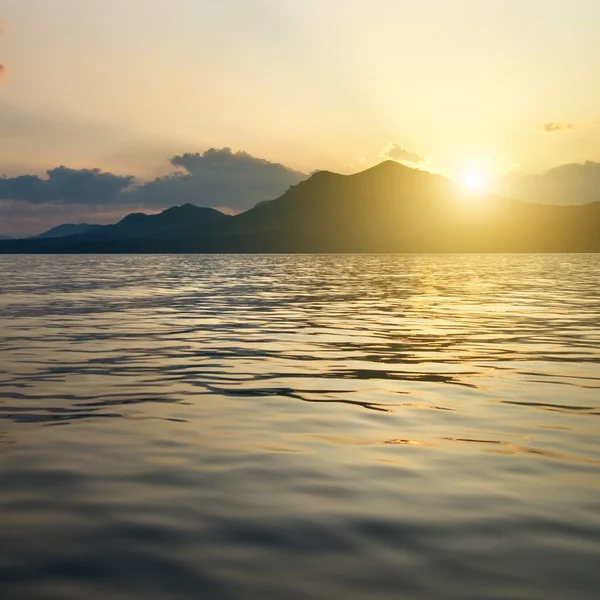 stock image Landscape with sea and mountains on sunset