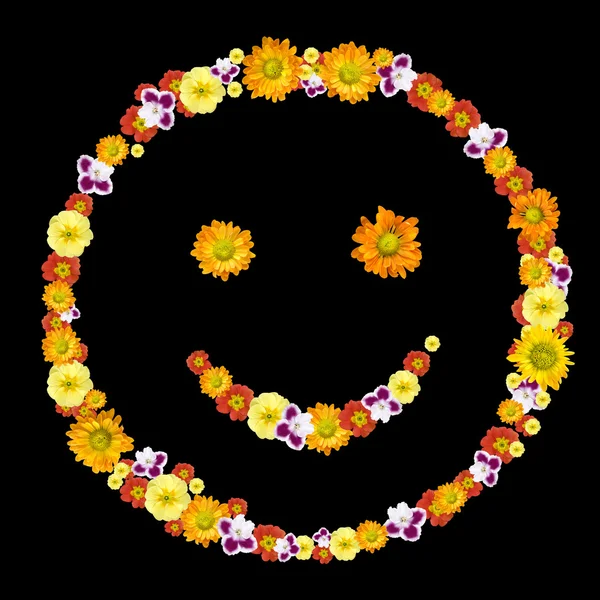 Dekoratives Lächeln Symbol aus farbigen Blumen — Stockfoto