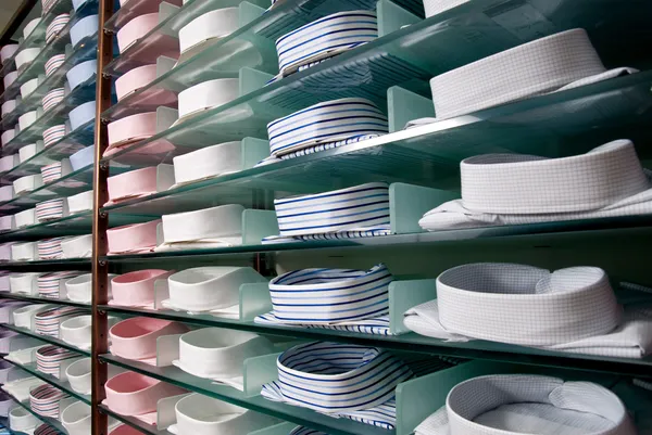 Shelf with shirts in store — Stock Photo, Image