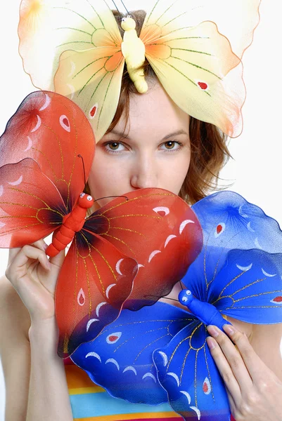 Vergadering meisje met kleur vlinders — Stockfoto