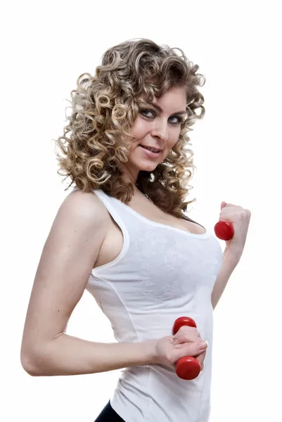 Portrait of young sexy woman holding dumbbells — Stock Photo, Image