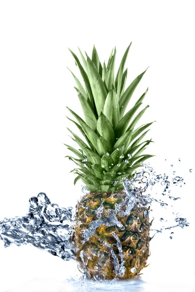 stock image Pineapple with water splash isolated on white