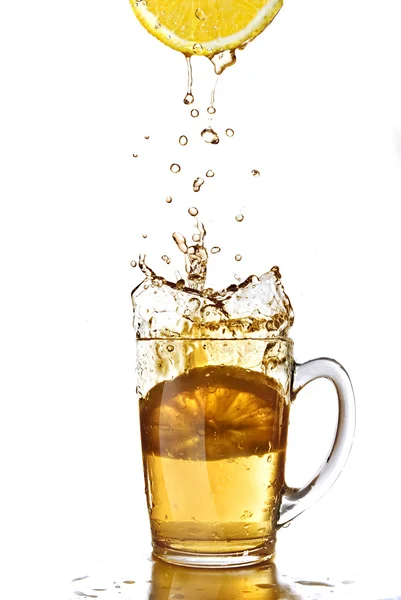 Fresh lemon juice and tea cup isolated on white — Stock Photo, Image