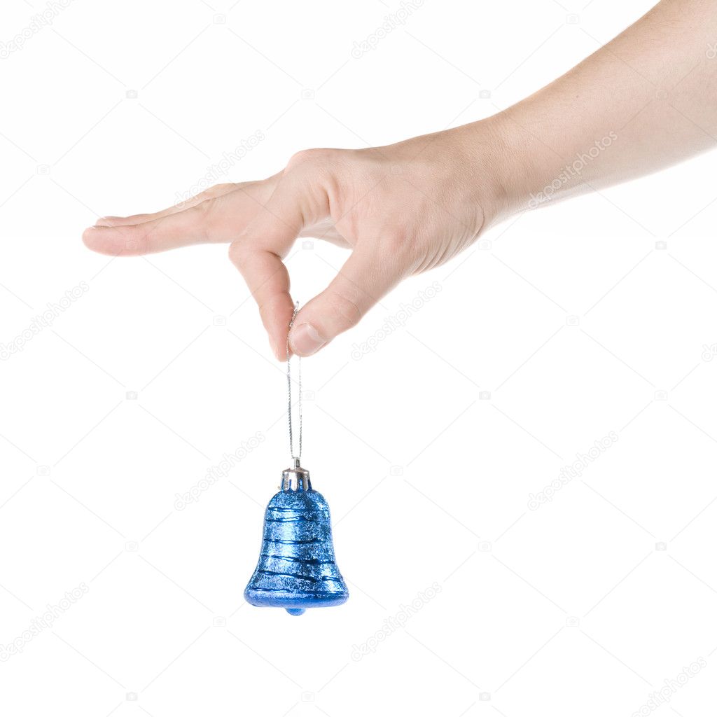 Arm holding blue christmas bell