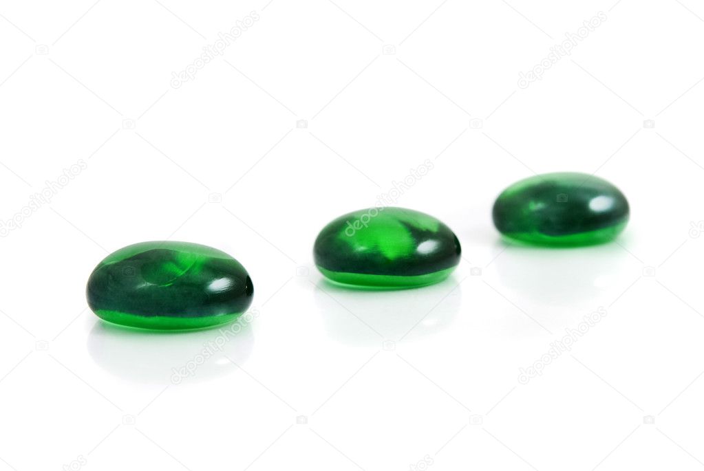 Zen-like spa green shiny stones isolated on white