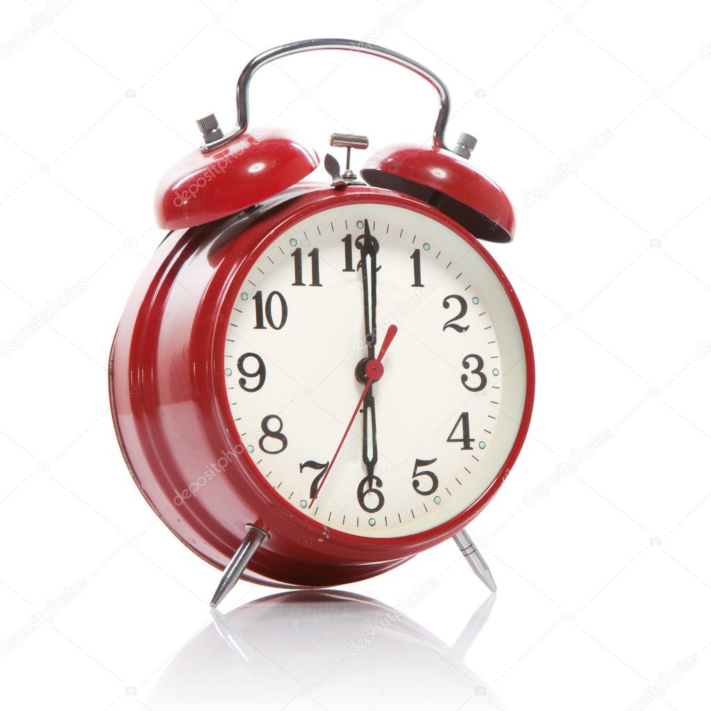 Red old style alarm clock isolated on white
