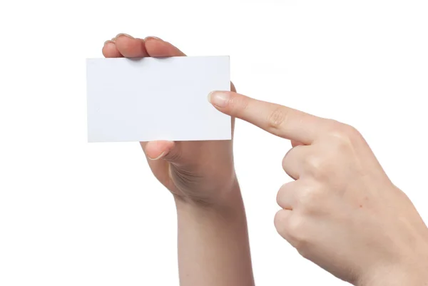 Mulher mão segurando vazio cartão de visita e apontando sobre ele — Fotografia de Stock