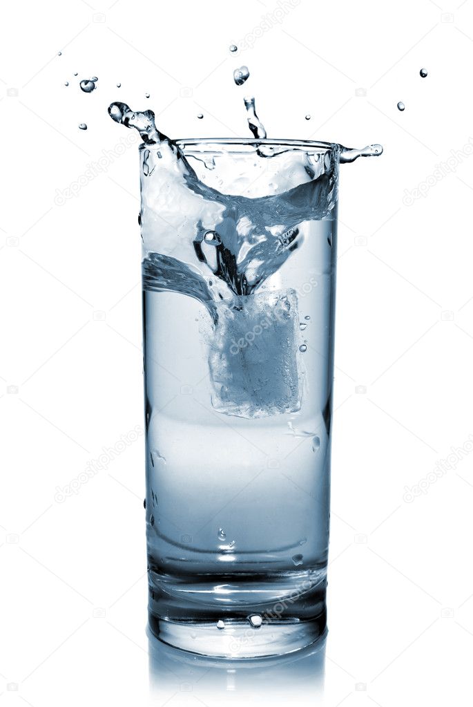 Water splash in glass isolated on white