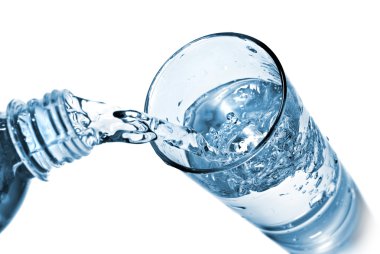 Water pouring into glass isolated on white clipart