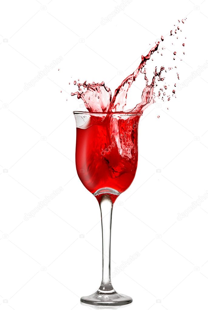 Splash of red wine in goblet isolated on white