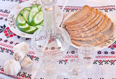 Vodka, bread and sliced cucumber