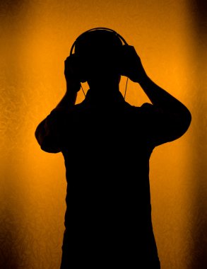 Music - silhouette of DJ with headset clipart