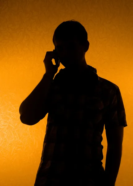 Silhouette of man speak over the phone — Stock Photo, Image