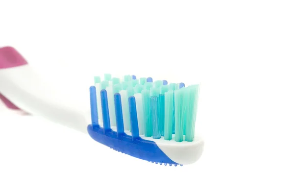 Fechar da escova de dentes no branco — Fotografia de Stock