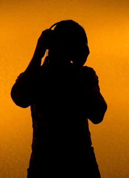 Music fan. Silhouette of man with earphones — Stock Photo, Image
