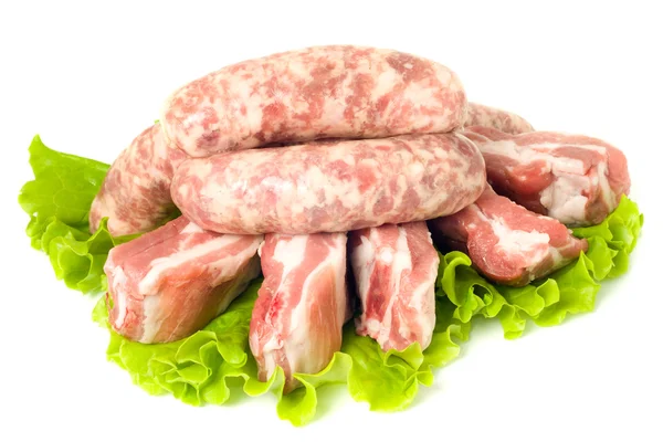 Cinco trozos de carne de cerdo y salchichas —  Fotos de Stock