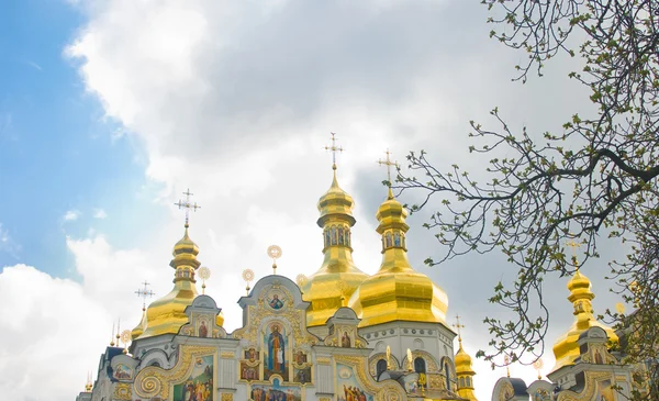 Laura in spring. Golden domes over cloudy sky — Stock Photo, Image