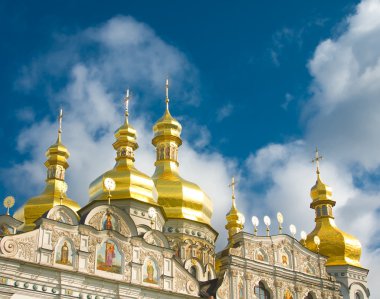 Orthodox church and blue sky with clouds clipart