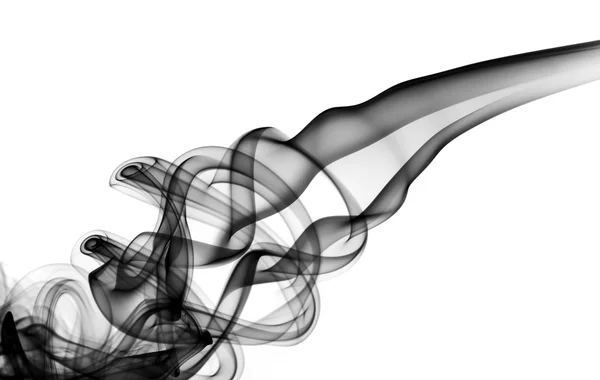 Fumée magique noire tourbillonnant sur blanc — Photo