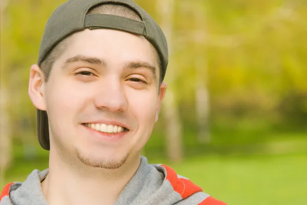 Smiling Casual young male in park — Stock Photo, Image