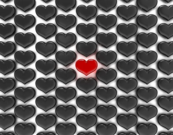 Одно красное сердце среди чёрных — стоковое фото