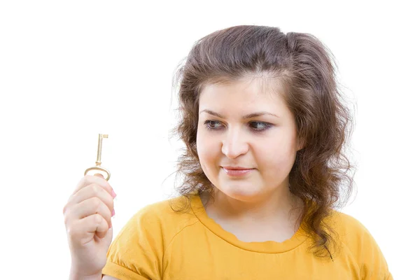 Key in the hands of a young woman — Stock Photo, Image