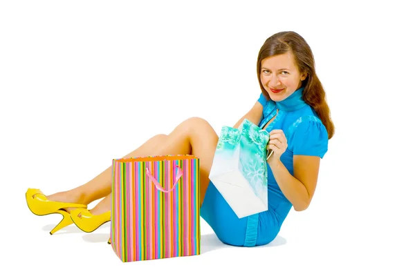 Girl in a bright dress with shopping — Stock Photo, Image