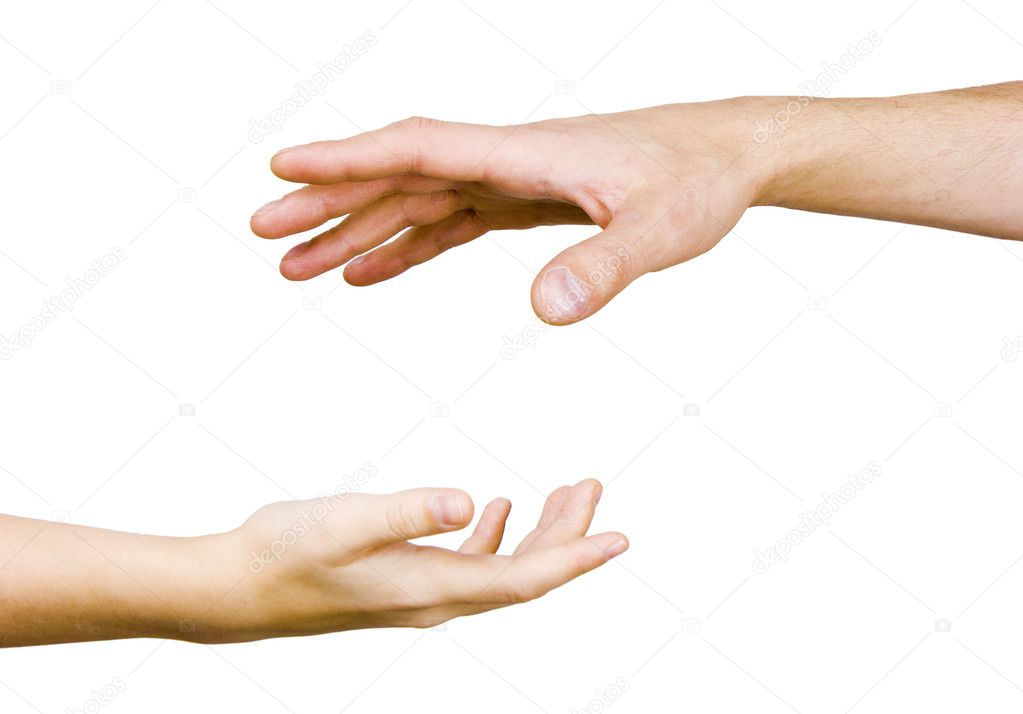 Child's hand reaches for the men's hand