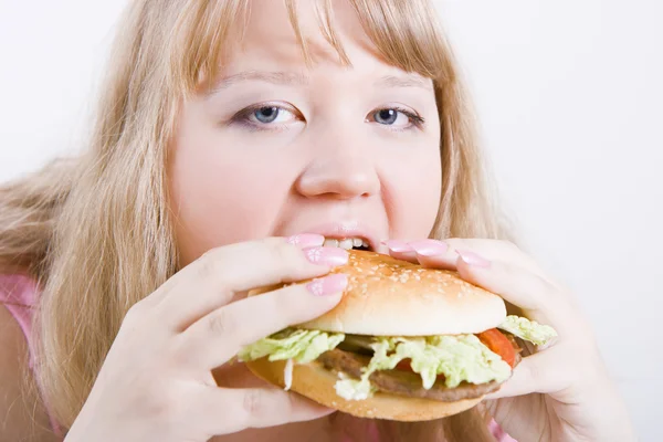 Şişman kız hamburger ile — Stok fotoğraf