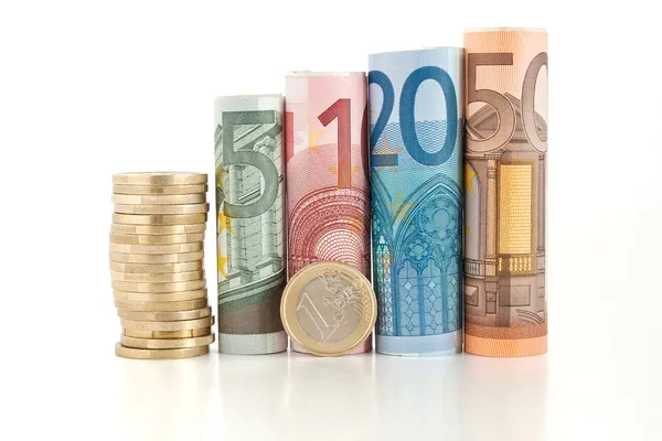 Billetes y monedas laminados en euros — Foto de Stock