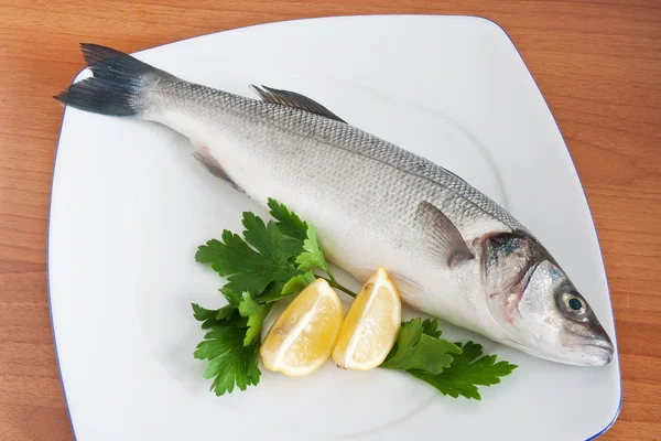 Sea bass with parsley and lemon — Stock Photo, Image
