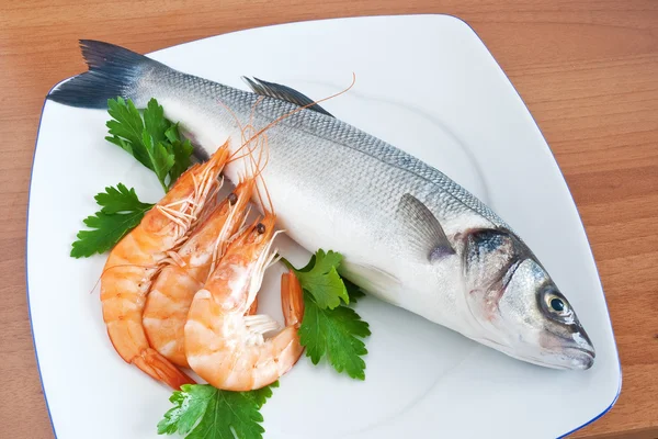 Sea bass with parsley — Stock Photo, Image