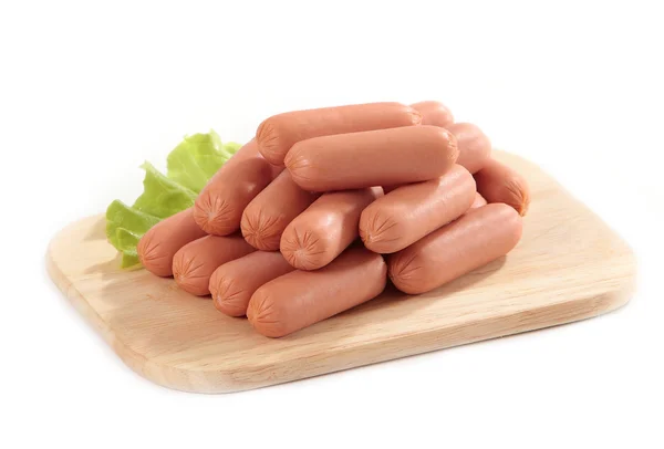 Boiled sausages on cutting board — Stock Photo, Image