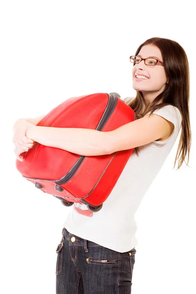 stock image Happy girl with suitcase on a white back