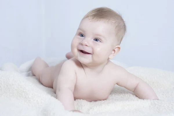 Baby lying on the bed — Stock Photo, Image