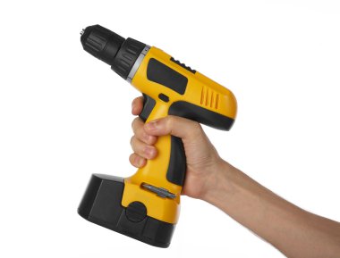 Battery drill in right hand clipart