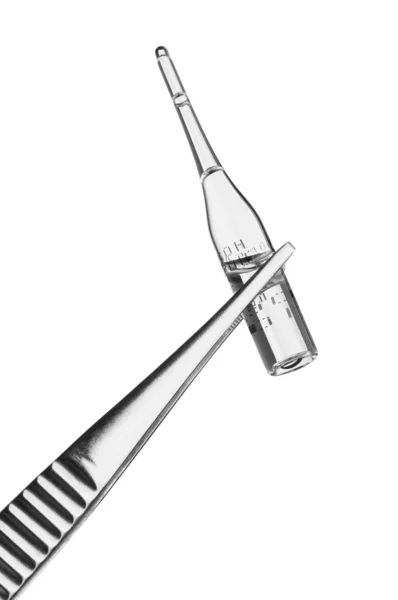 Tweezers with an ampoule — Stock Photo, Image