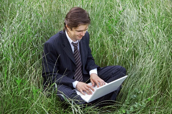 stock image Business man using laptop