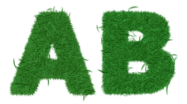 Dvě písmena abecedy zelené trávy — Stock fotografie