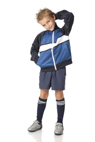 足球制服的年轻男孩 免版税图库图片