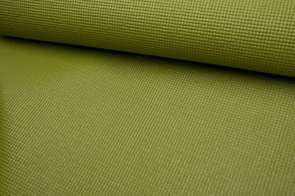 绿色瑜伽运动垫 — 图库照片