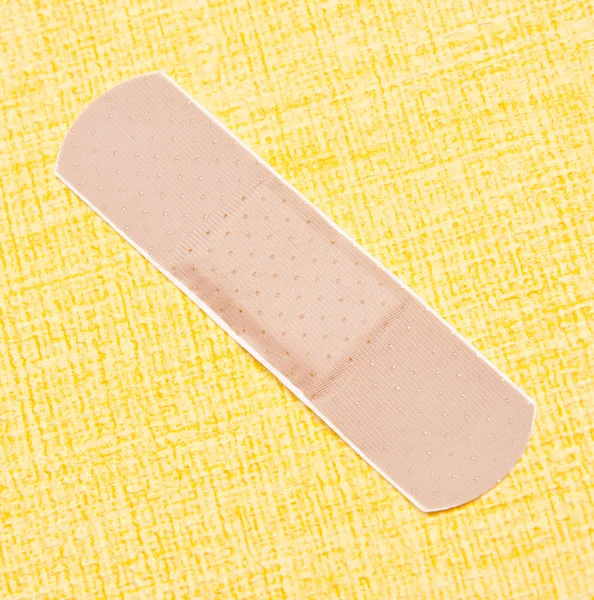 Band Aid on Yellow — Stock Photo, Image