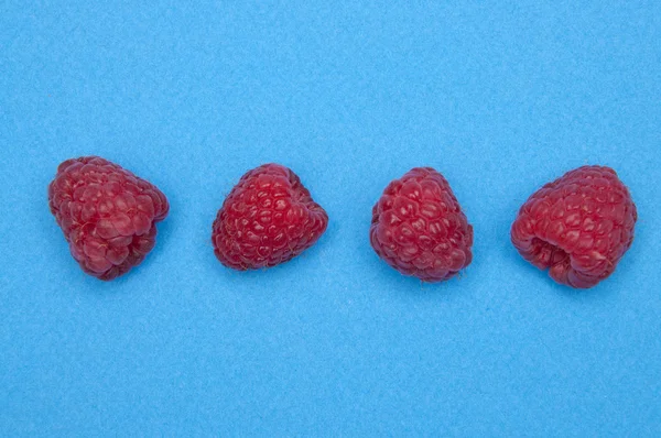 Raspberries on Blue — Stock Photo, Image