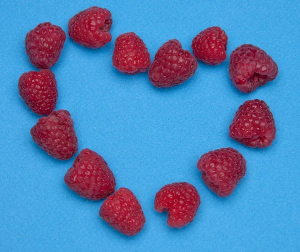 Raspberry Heart on Blue — Stock Photo, Image