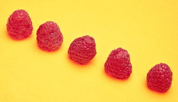 Raspberries on Yellow — Stock Photo, Image
