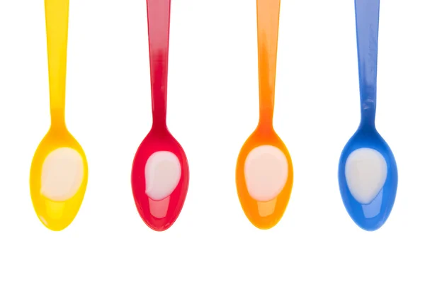 Vibrant Spoons Full of Milk — Stock Photo, Image