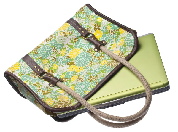 Yeşil dizüstü bilgisayar ile çiçekli çanta — Stok fotoğraf