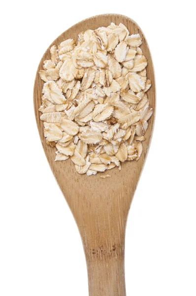 Avena fresca de grano entero en una cuchara de madera — Foto de Stock